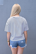 Back view of relaxed fit striped breastfeeding shirt with hidden nursing access, lightweight black and white nursing tee designed for breastfeeding.