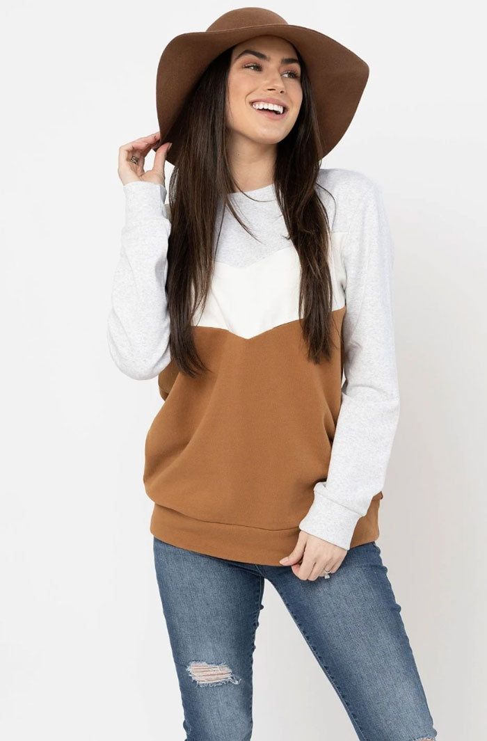 wearing a camel colorblock nursing sweatshirt