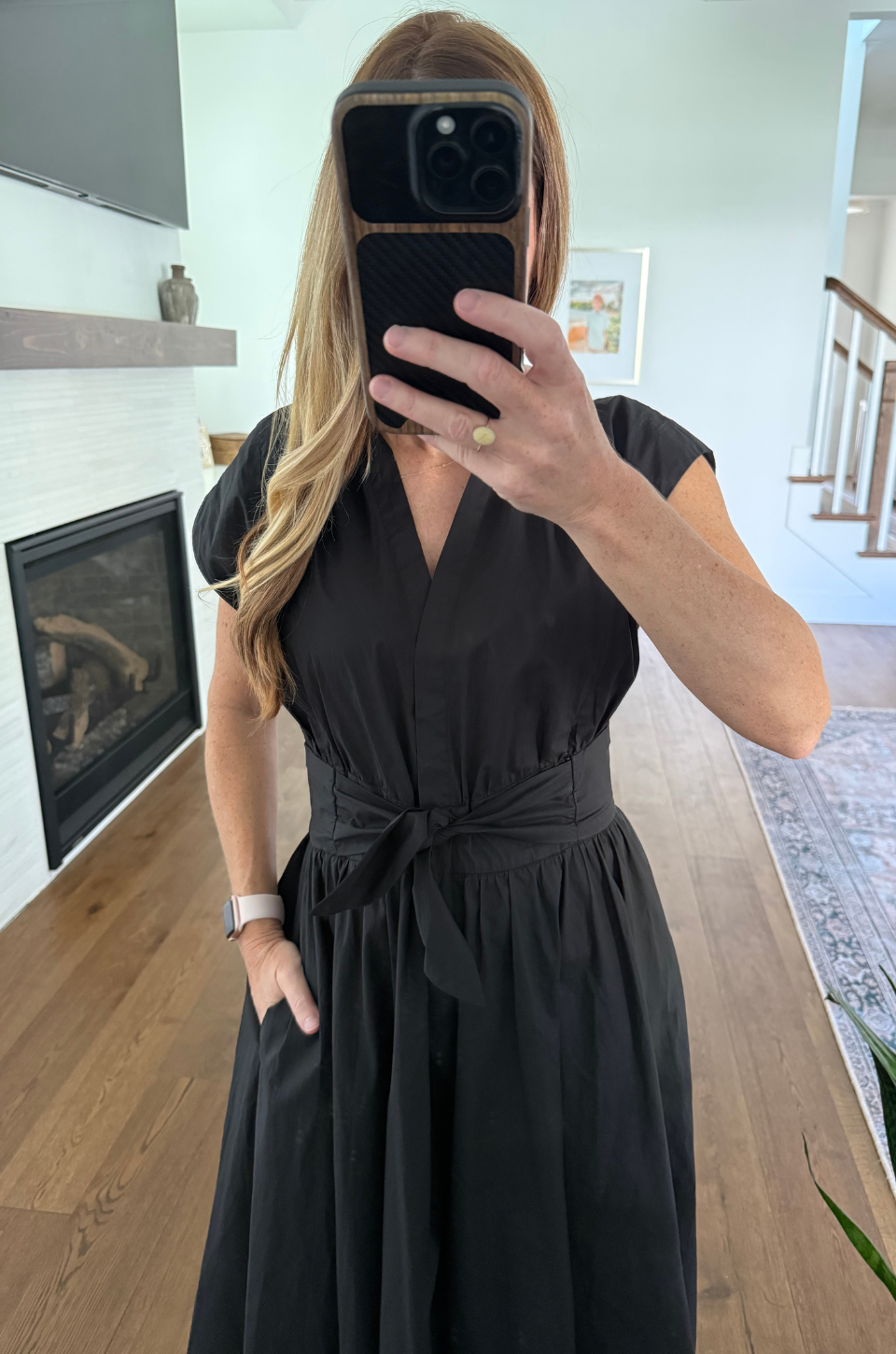 cotton black nursing dress in a mirror selfie
