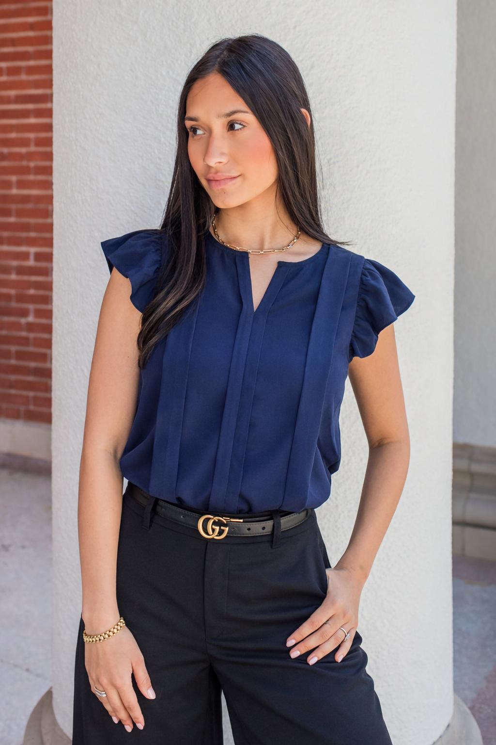 woman wearing a nursing work blouse with hidden zippers for breastfeeding