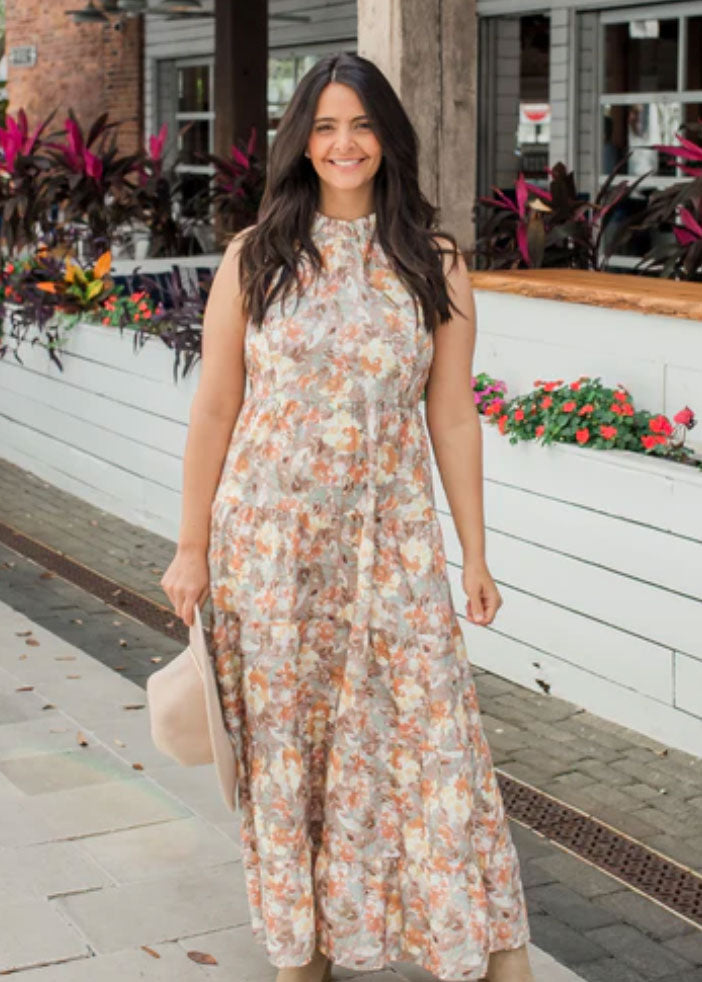 model wearing a floral nursing dress