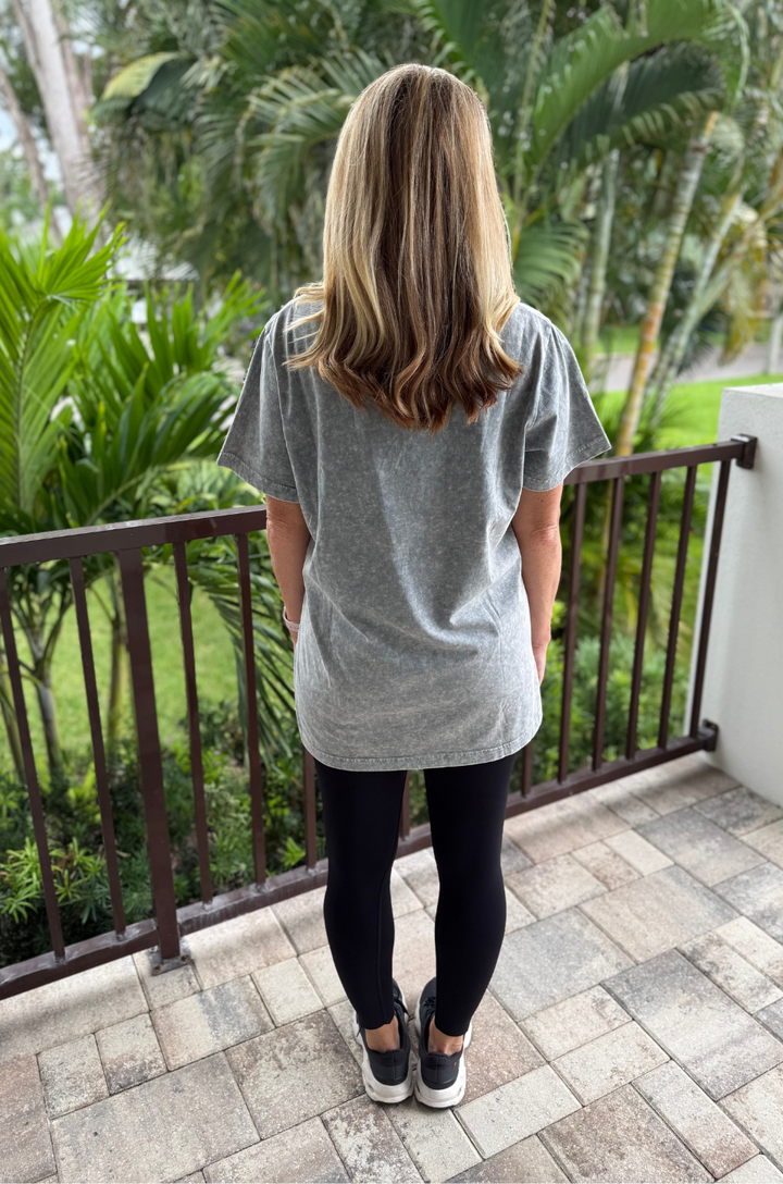 A back view shows a mom wearing the oversized Free Bird graphic stonewash gray breastfeeding tee with a relaxed fit and full coverage.