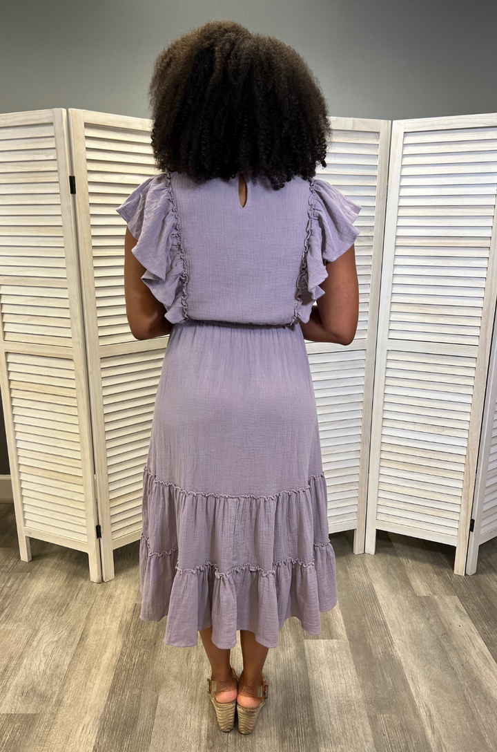 A back view shows a mom wearing the lavender gauze cotton midi breastfeeding dress, emphasizing a modest silhouette with smooth, comfortable coverage.