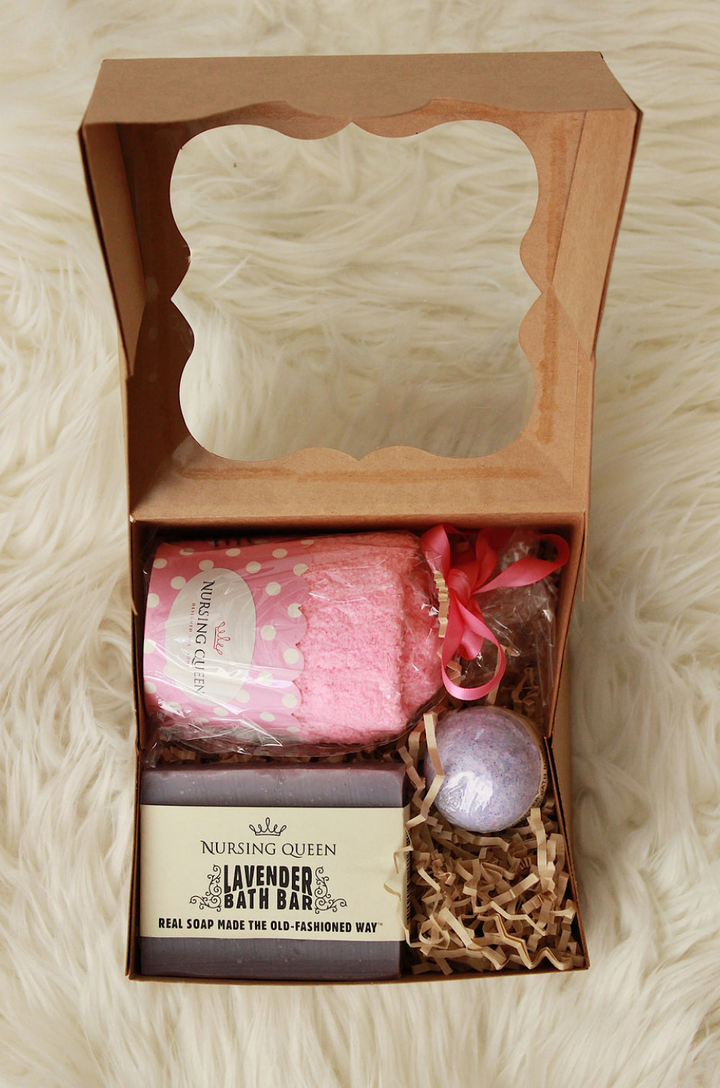 Gift set containing a pair of socks, bath supplies and a bar of soap, arranged together. 
