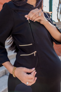 Hidden gold zipper nursing access on the black maternity and nursing dress for easy breastfeeding.