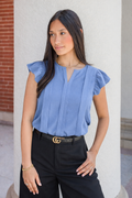 woman wearing a light blue work nursing blouse for breastfeeding with hidden zippers
