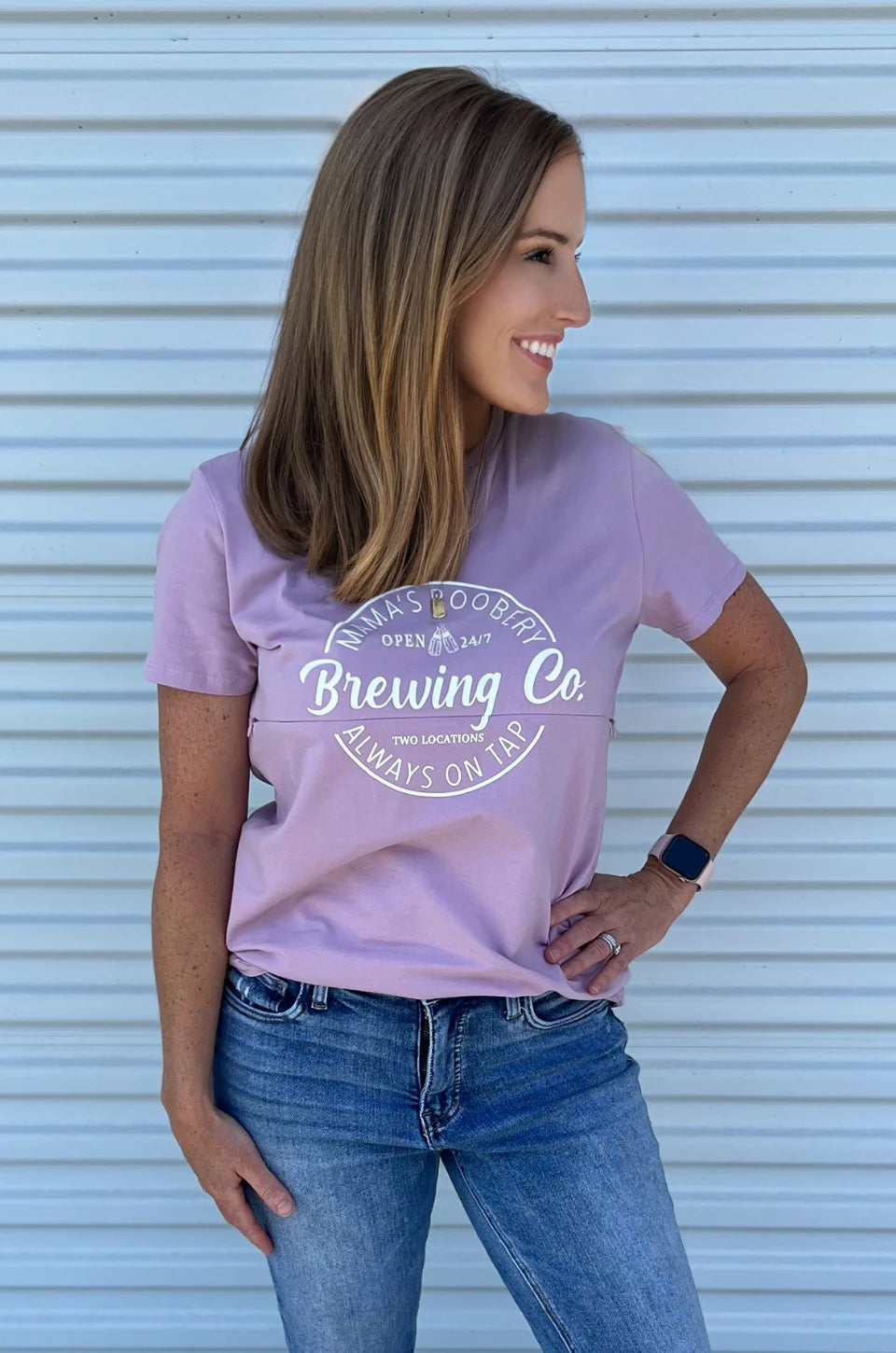 woman wearing a lilac mama’s boobery brewing co graphic tee