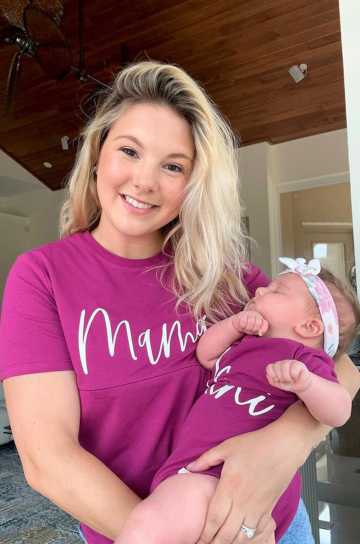 Matching mom shirt and baby onesie with cursive “mama” and “mini” lettering shown together.
