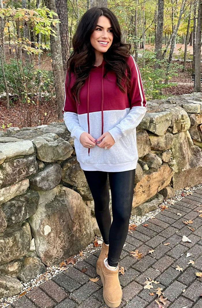 model wearing a maroon fleece nursing hoodie