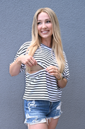 Black and white striped breastfeeding t-shirt with hidden nursing and pumping access, relaxed fit short sleeve top for breastfeeding moms, comfortable everyday nursing shirt.