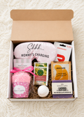 new mom 4th trimester gift box for breastfeeding moms with pink socks, soap, bath bomb, mother's milk tea, eye mask