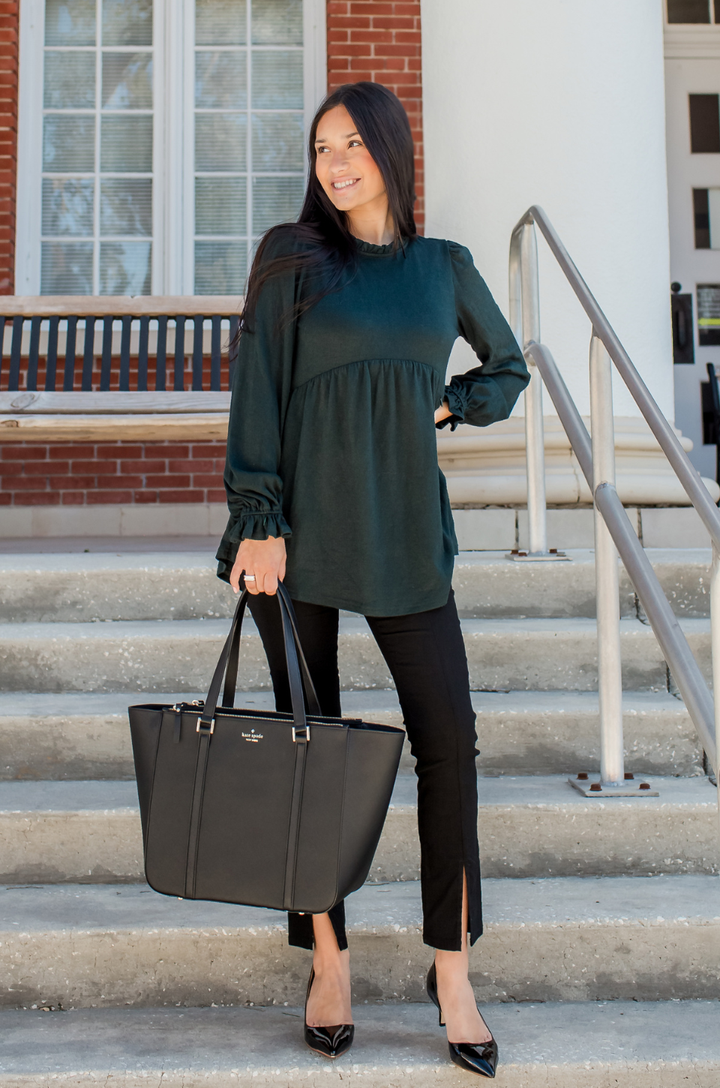 Babydoll nursing sweater styled as a professional work outfit in deep green.