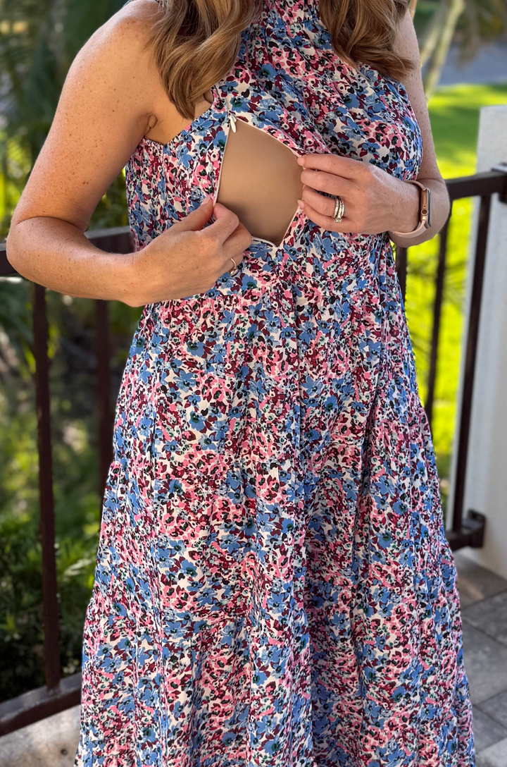 A close-up shows the hidden breastfeeding access on the Nursing Queen berry garden tie-back bow dress, designed for discreet feeding.
