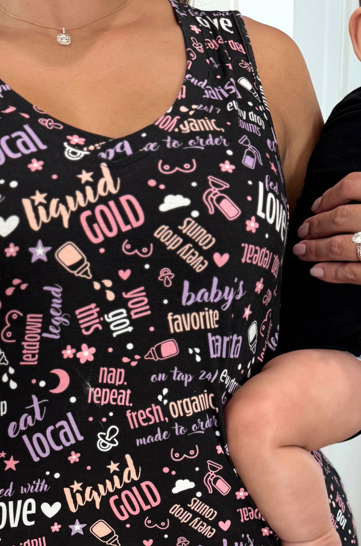 Close-up of graphic print fabric on breastfeeding pajamas with nursing and pumping phrases. 