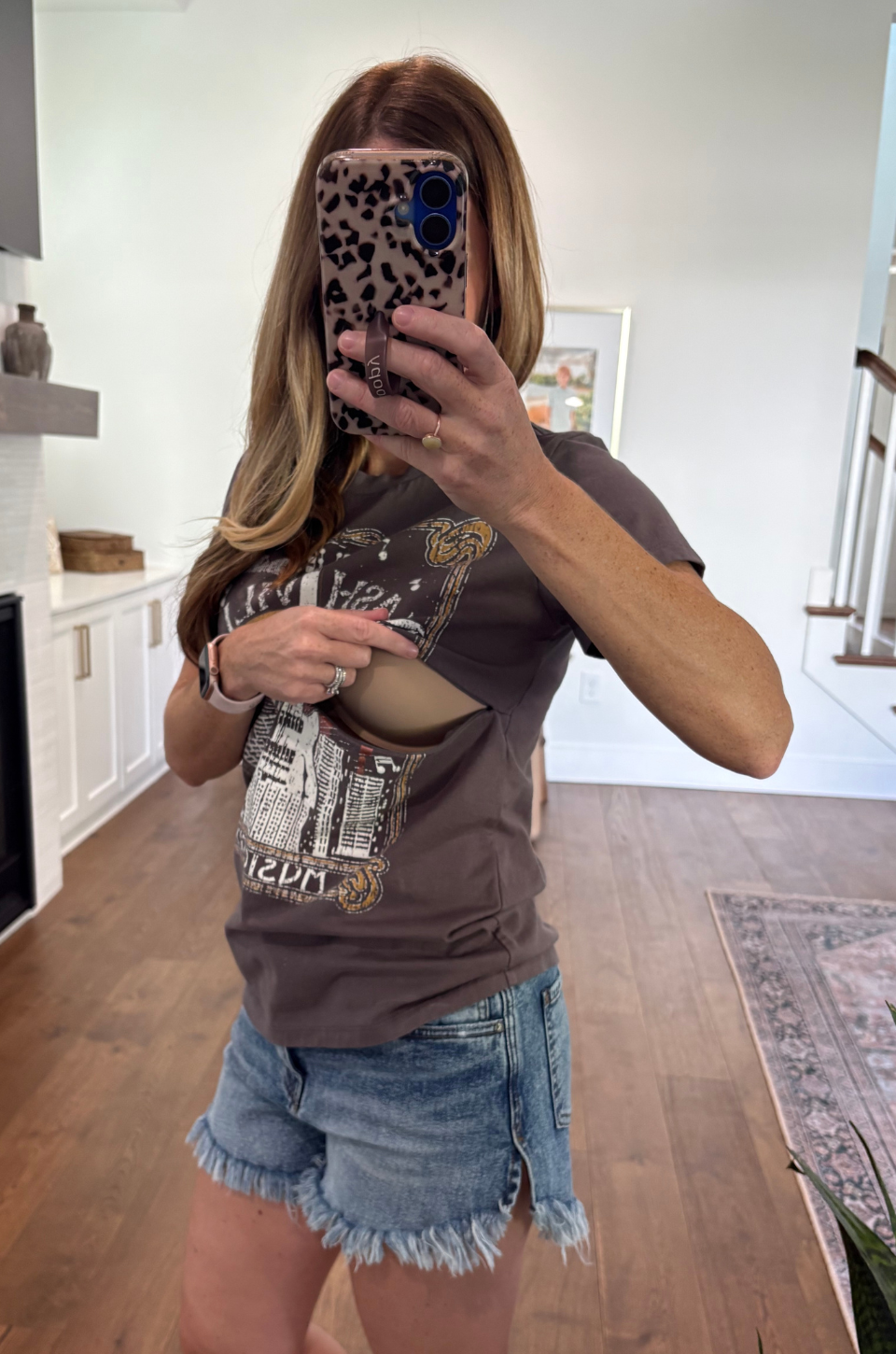 Mom showing the hidden nursing access in a Nashville tee 
