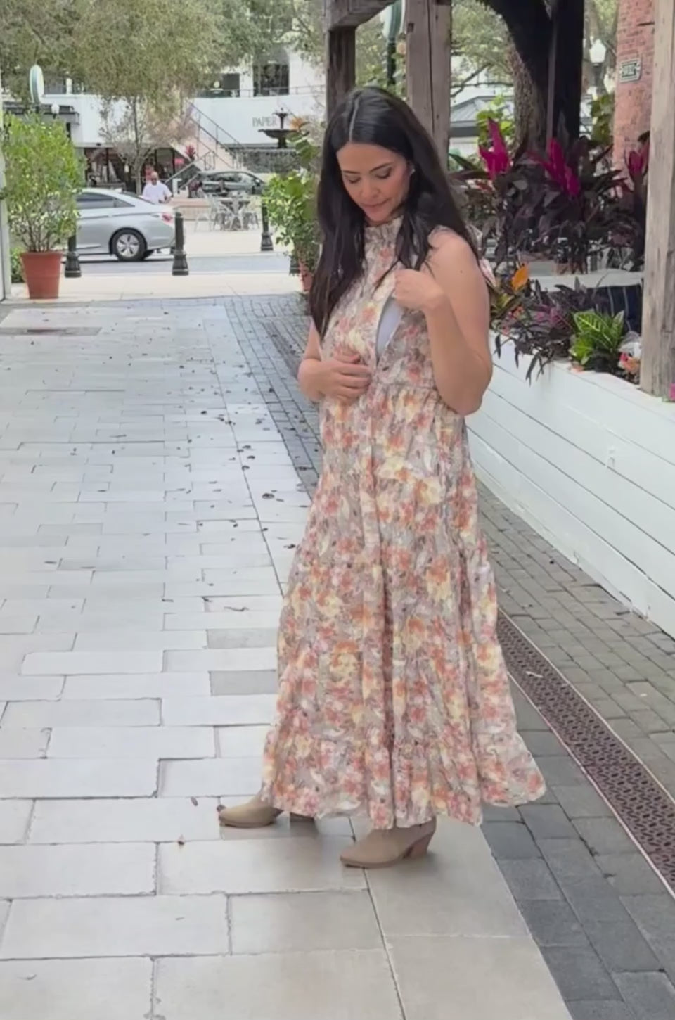 In this video a mom demonstrates how the hidden breastfeeding access works in this sunset floral nursing dress. 