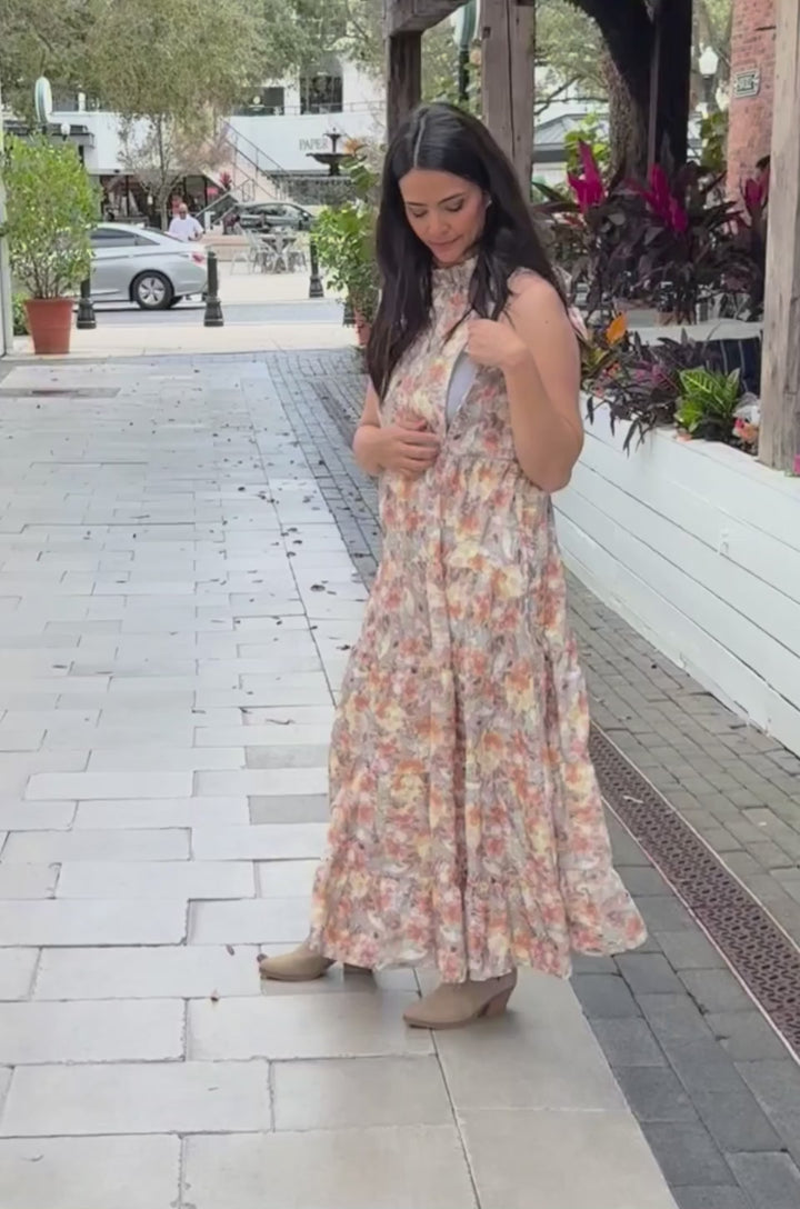 In this video a mom demonstrates how the hidden breastfeeding access works in this sunset floral nursing dress. 