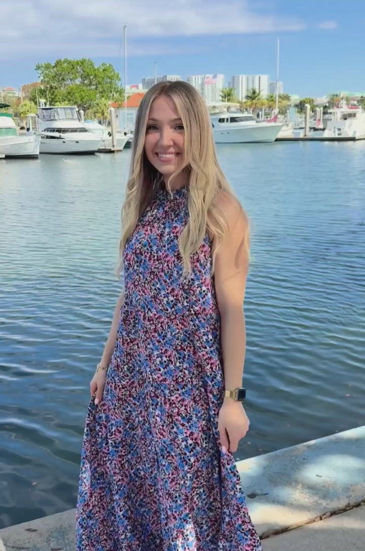 In this video a woman shows how the hidden zipper nursing access works for breastfeeding in this summer dress. 