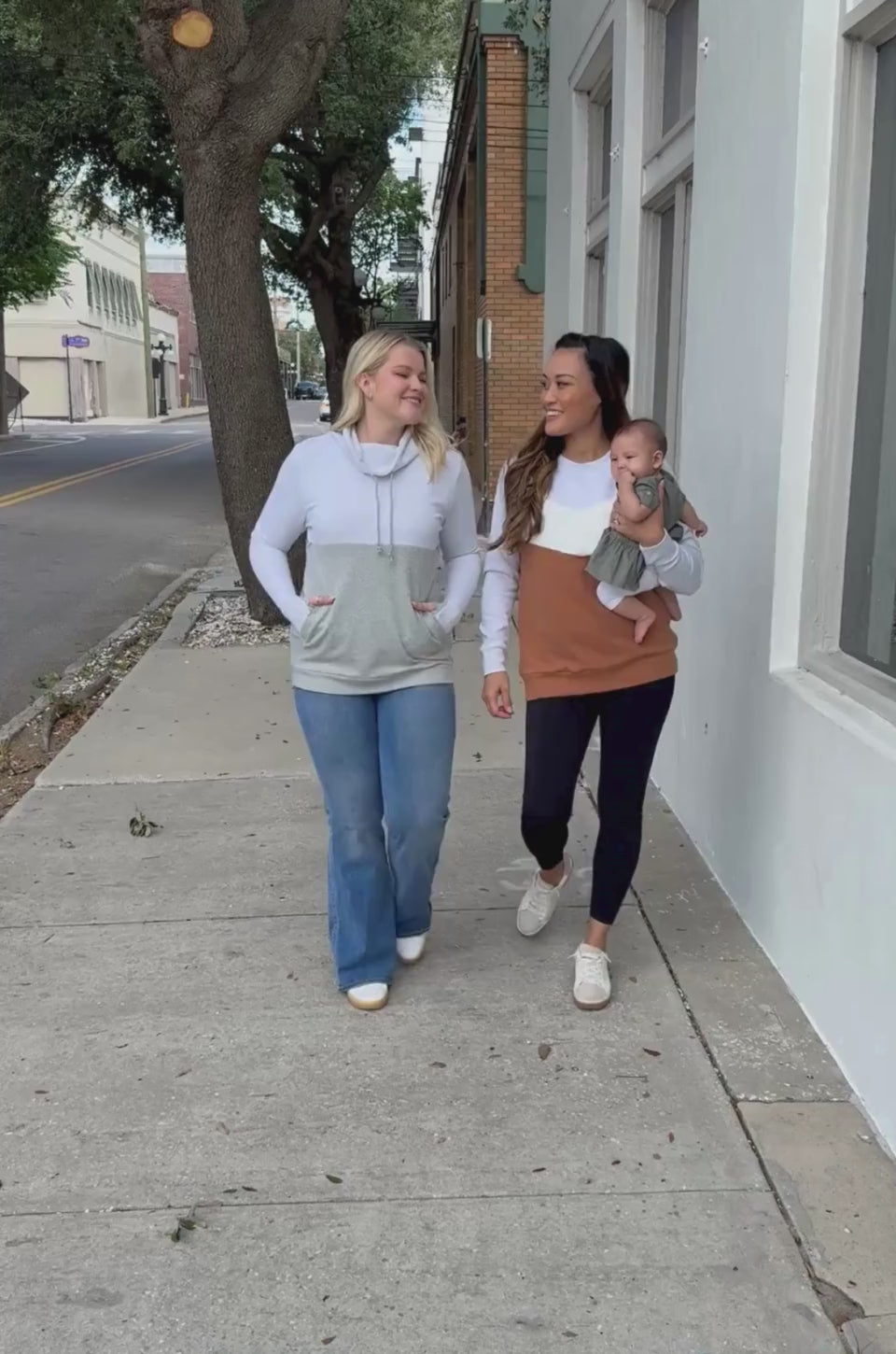 Moms wearing breastfeeding sweatshirts with zipper nursing and pumping access