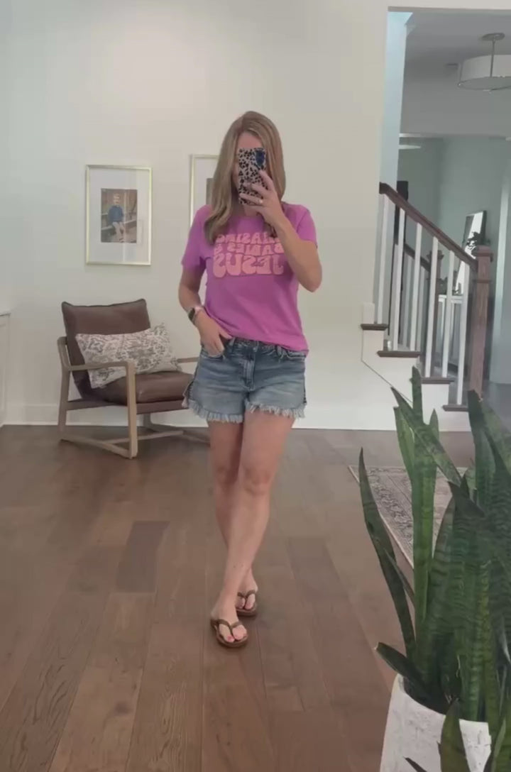 Video showing a breastfeeding mom modeling a purple breastfeeding T-shirt and demonstrating how the hidden nursing access works. 
