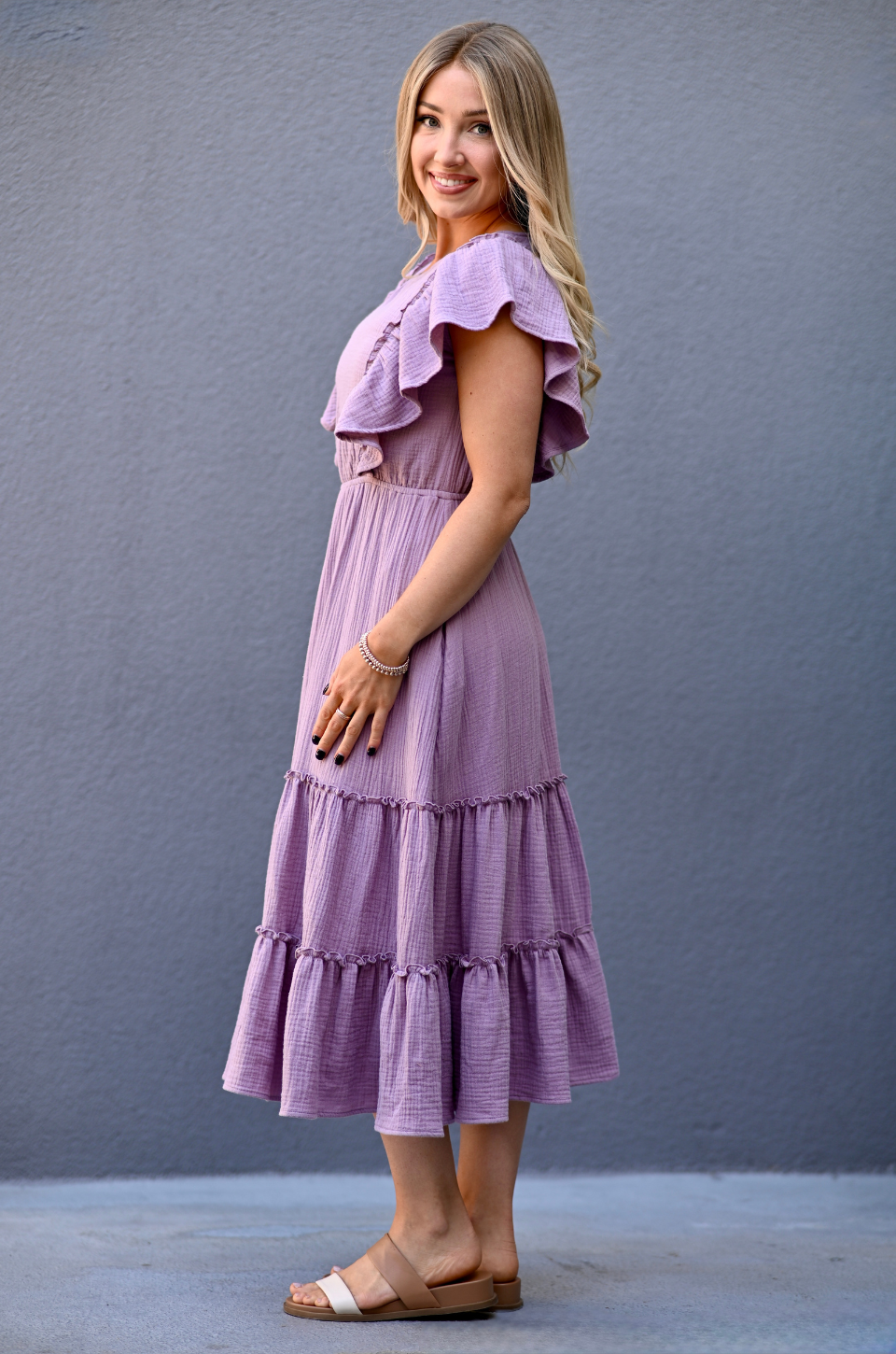 Side view of lavender gauze midi nursing dress with flowy silhouette suitable for postpartum wear.