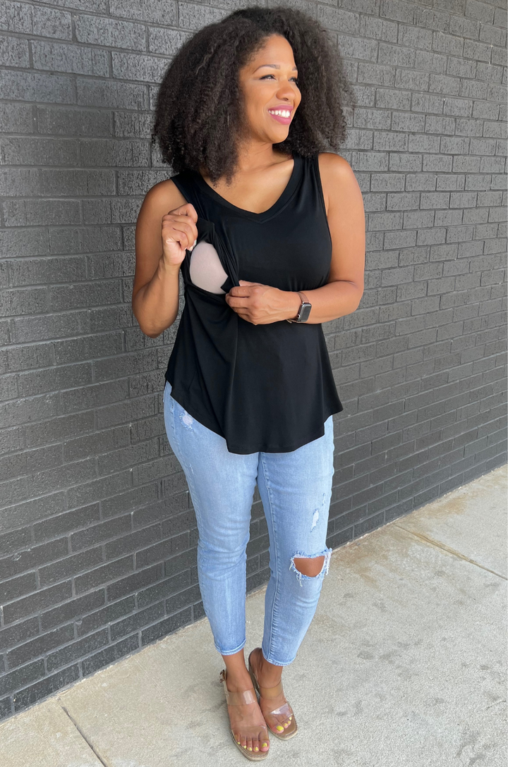 Close-up of side opening on black breastfeeding swing tank top revealing nursing and pumping access.