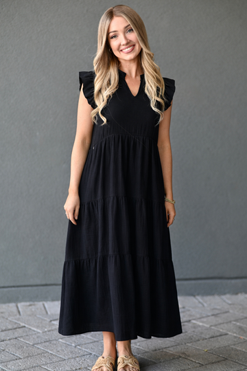 woman wearing black nursing dress for pumping and breastfeeding with hidden zipper access