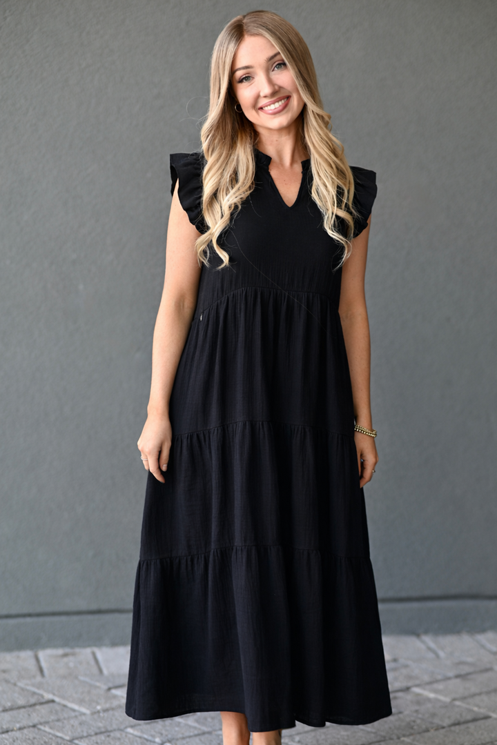 woman wearing black nursing dress for pumping and breastfeeding with hidden zipper access